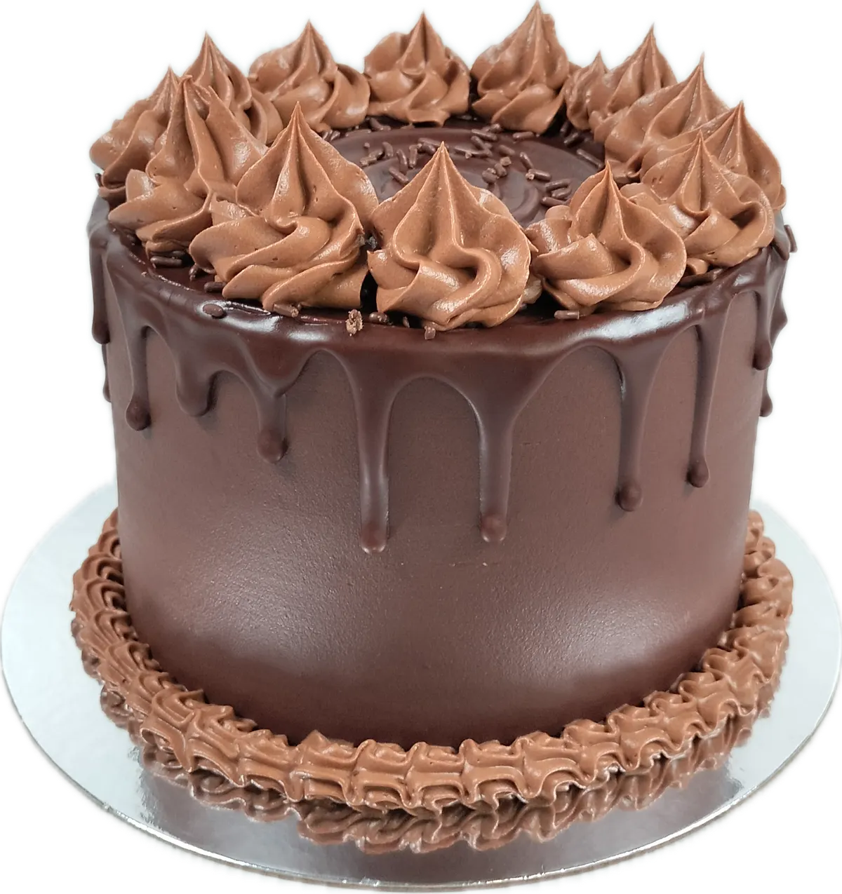 Torta cubierta de chocolate con hilos que caen por el borde y rosetas de crema de chocolate